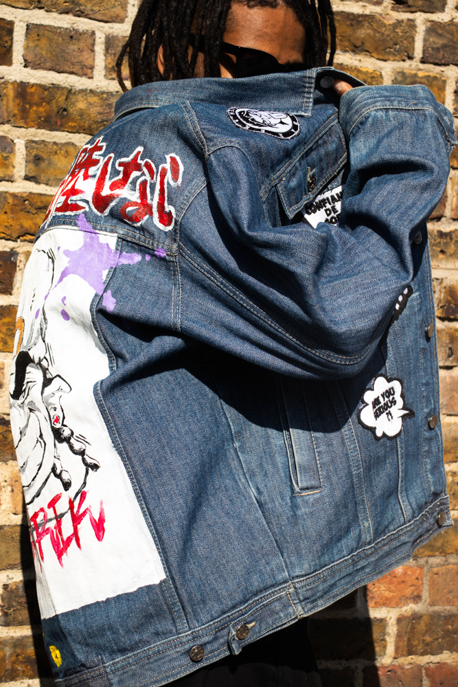 Model in a denim jacket with a printed design